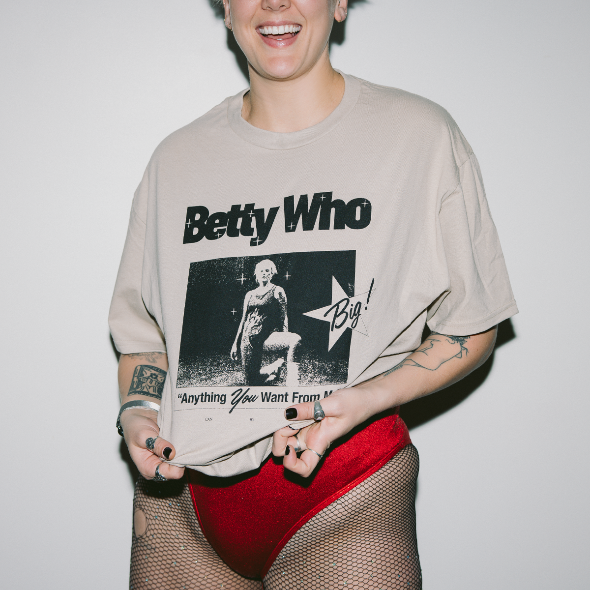 Image of Betty Who wearing one of her tour t-shirts
